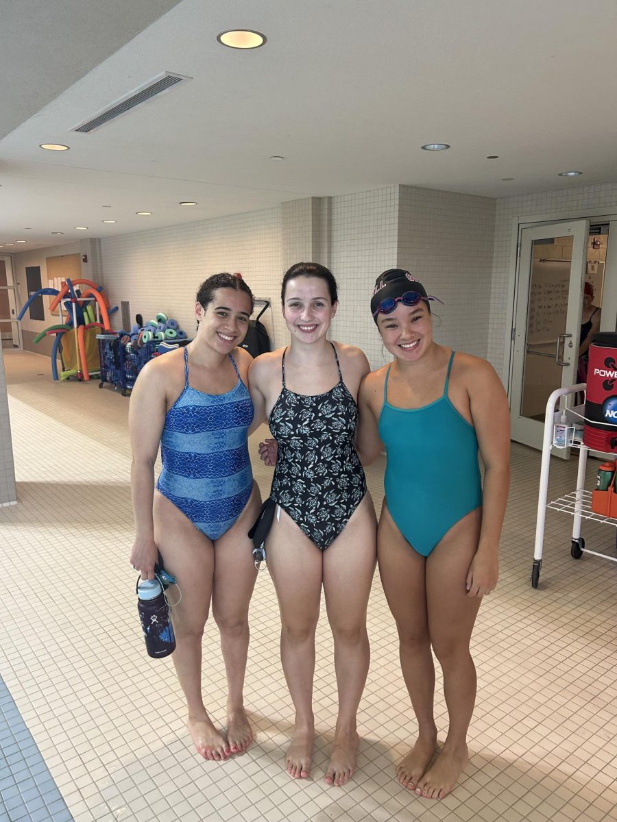 Josephine Hopkins `28, Clare Clarkson `29 and Joely Kam `28 pose in Natatorium.