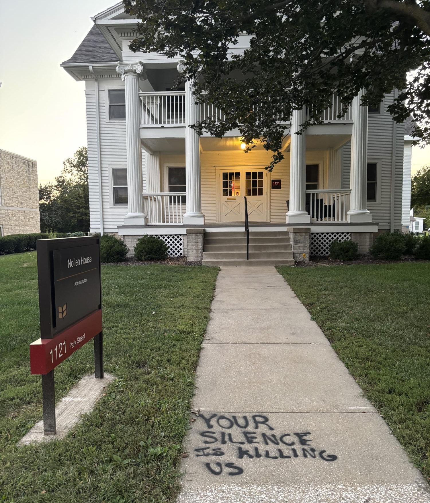 One political message outside of Nollen House, pictured on Sept. 28 at 7:06 p.m., read "YOUR SILENCE IS KILLING US."