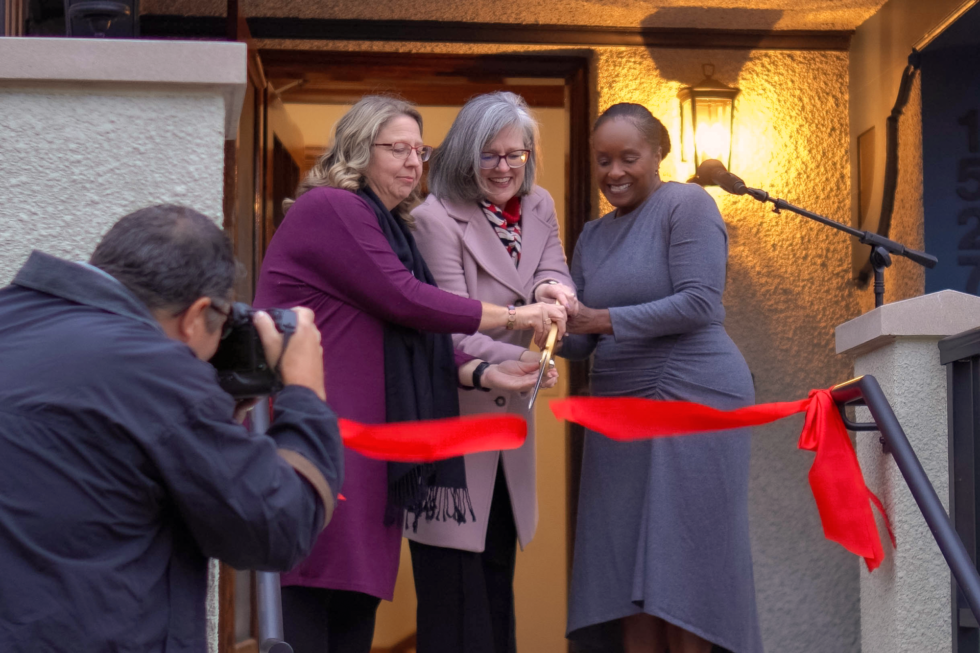From left: Assistant Vice President for Auxiliary Services Rachel Bly `93, College President Anne Harris and Vice President for Development and Alumni Relations Bernadine Douglas cut the ceremonial ribbon to open the Hannah Alumni House on Thursday, Nov. 6.