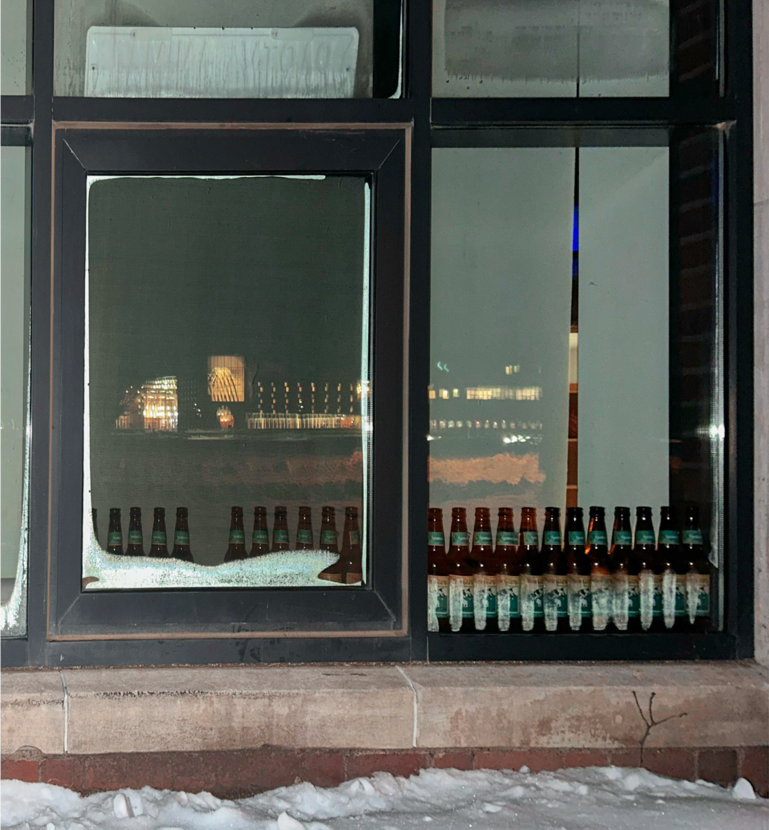 On the way to Harris Center, beer bottles line the window of a residence hall's window on Dec. 4, 2025. 