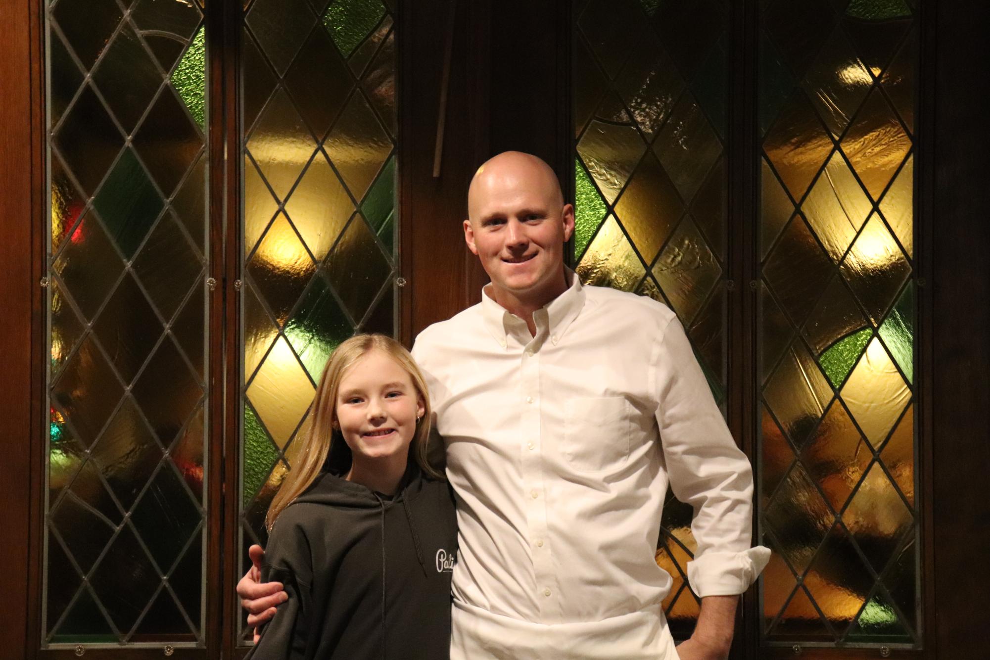 Joey Pagliai, 40, and Paisley Pagliai, 11, pose in Pagliai’s on Dec. 2, 2025. The duo has been in charge of Pagliai’s TikTok account since 2020.