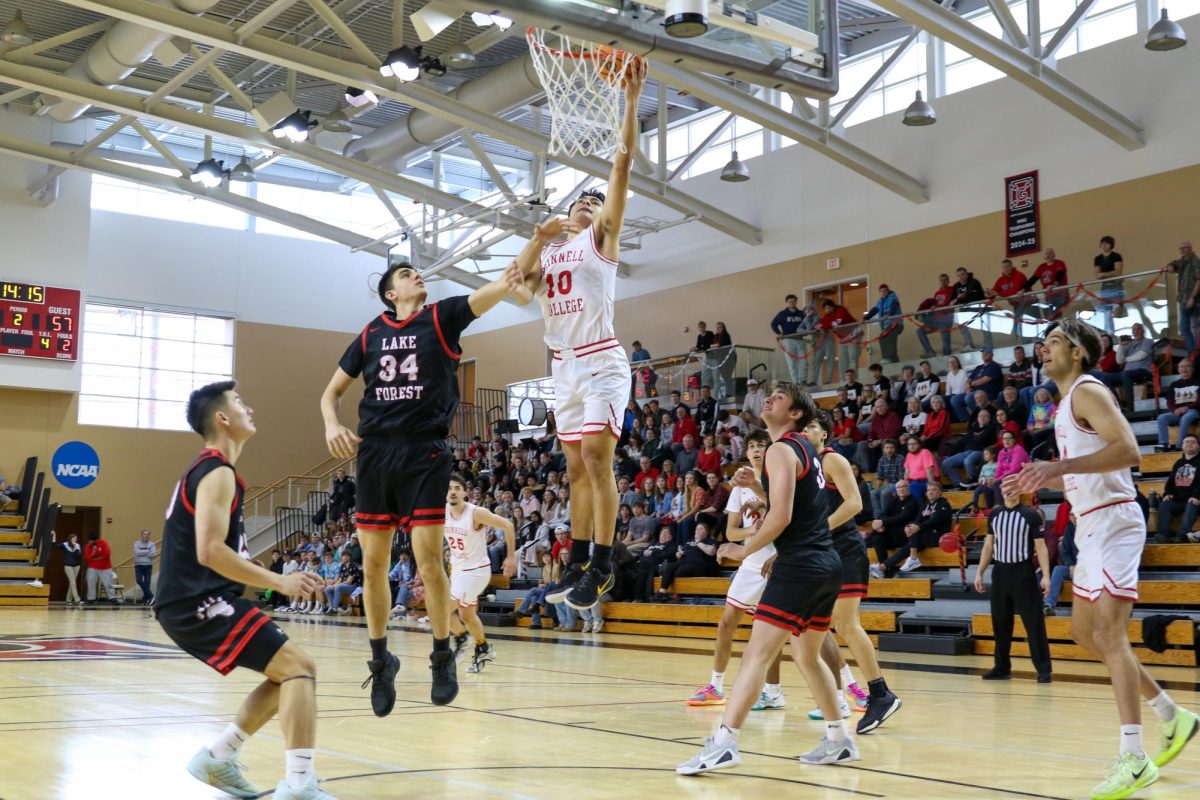 Gabe Garcia (10) jumps for the rim in a game against Lake Forest in Darby Gymnasium on Saturday, January 24, 2026.