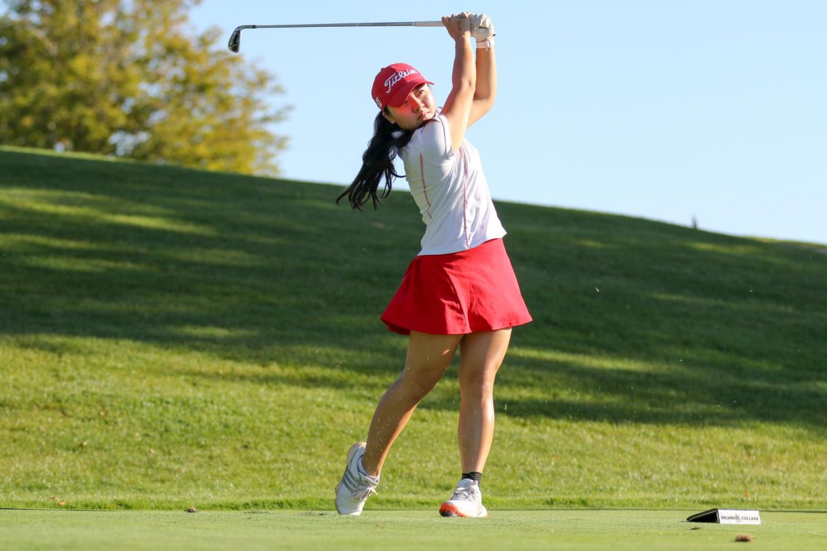 Meilin Hoshino `27 hits an iron in practice at the Grinnell College Golf Course on Sept. 26, 2024. Grinnell women’s golf is ranked 19th nationally