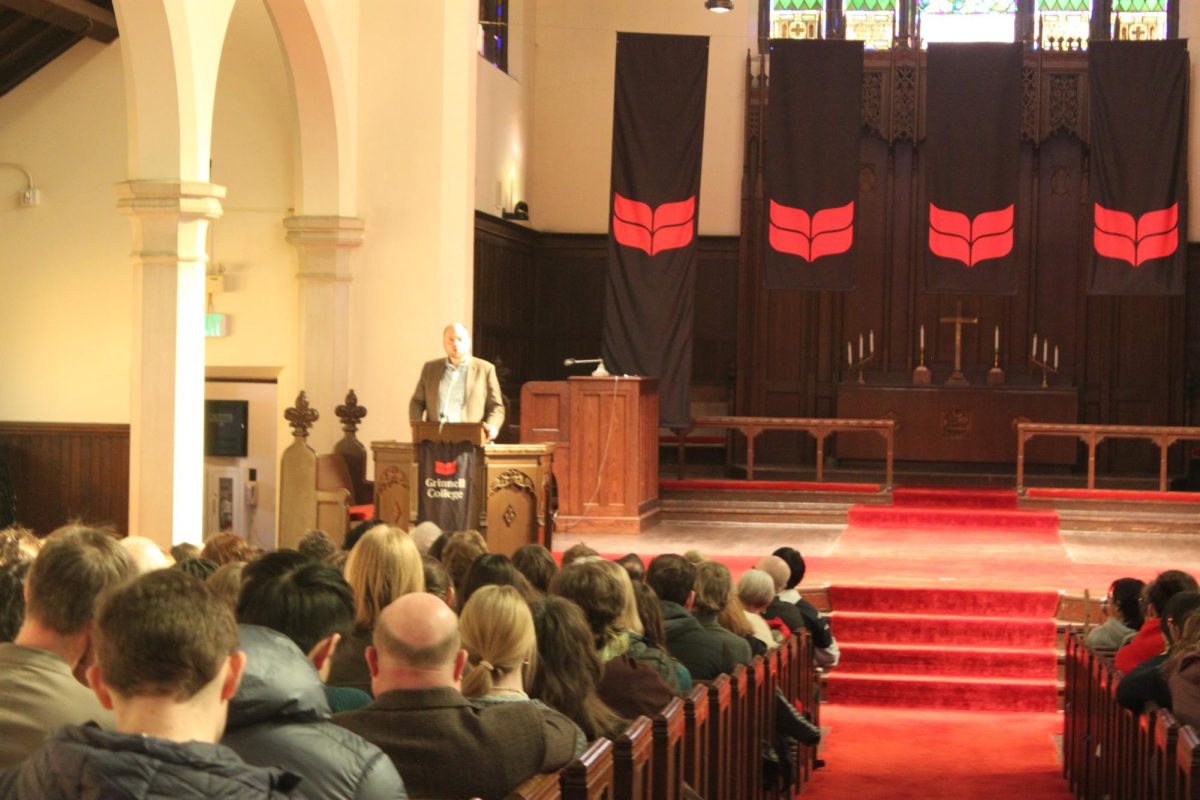 A packed crowd in Herrick Chapel listens to former political prisoner and Russian dissident Vladimir Kara-Murza speak on Feb 5. The event was the best-attended talk at Grinnell in 11 years, according to Professor Ed Cohn.