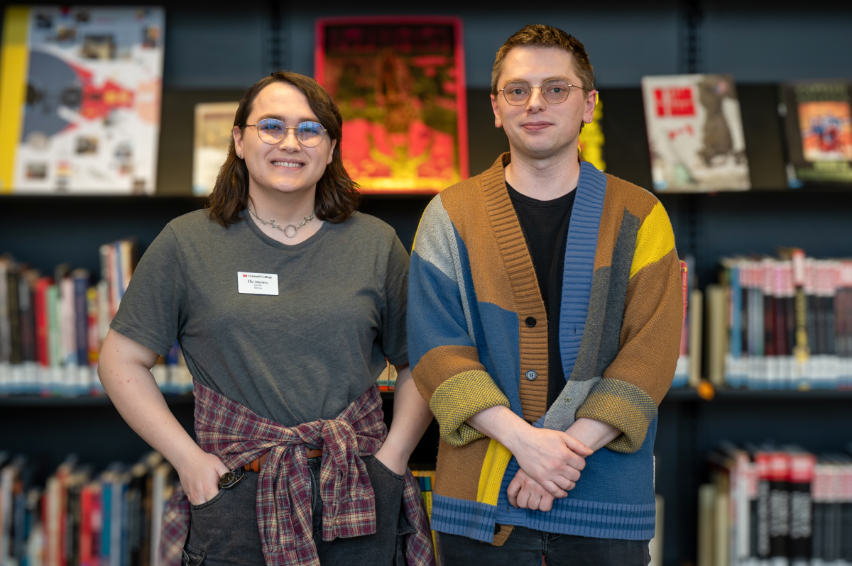 From left: Game Masters Ellsi Mertens and Max Schafer pose inside of Burling Library.