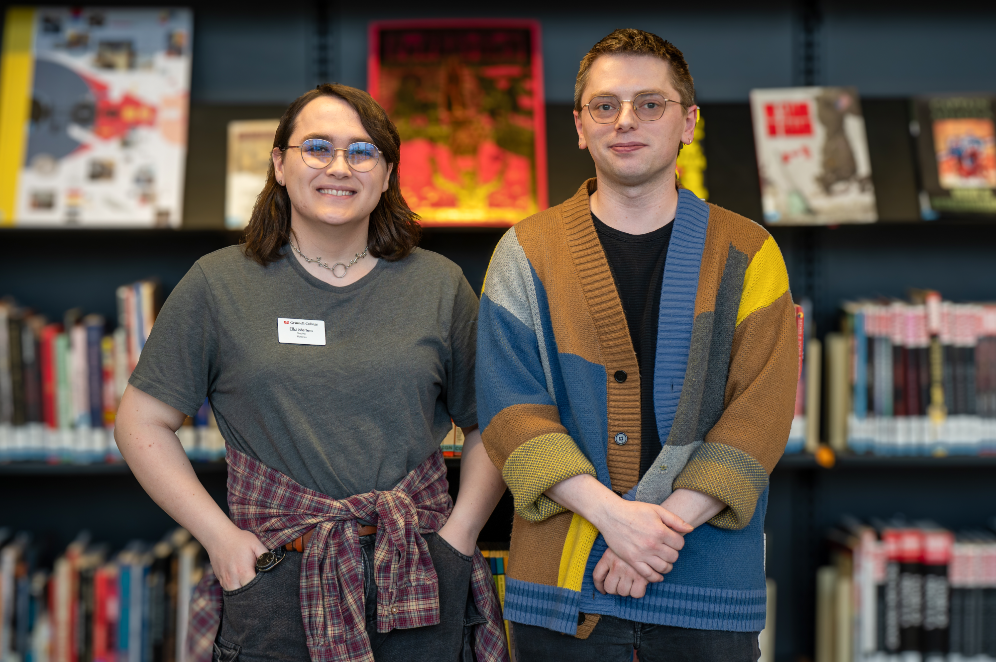 From left: Game Masters Ellsi Mertens and Max Schafer pose inside of Burling Library.
