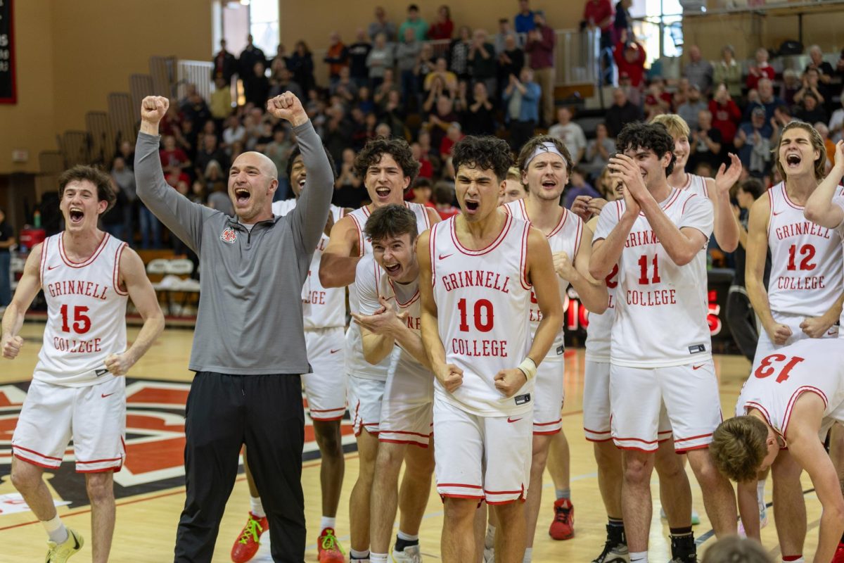 Head Coach, David Arseneault Jr., grey, celebrates with his team after winning the MWC Championship game against Monmouth at Darby Gym on Saturday, Feb. 28.