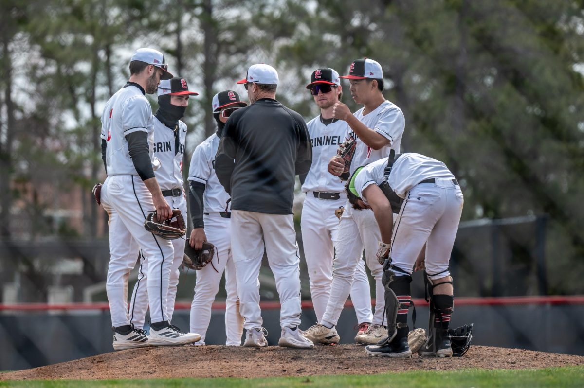 Head Coach Tim Hollibaugh visits the mound to consult the team in a game against Knox College on March 29, 2026.