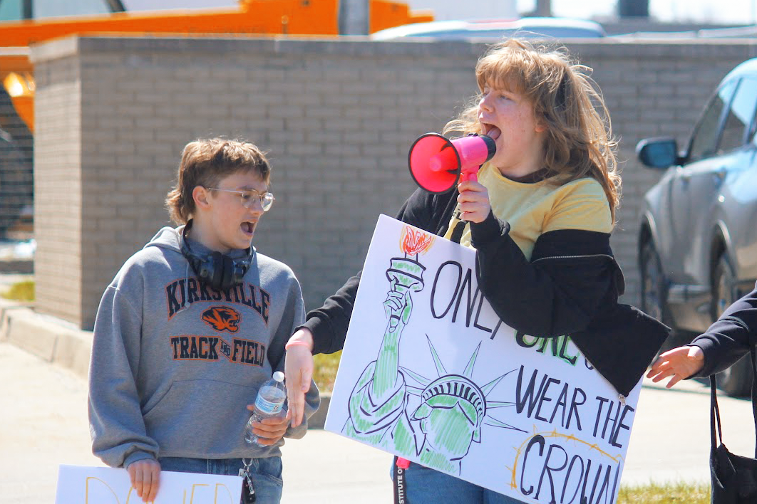 From left: Owen Sterup `29 and Lucille Buchheit `29 protest during the Grinnell "No Kings" demonstration on March 28.