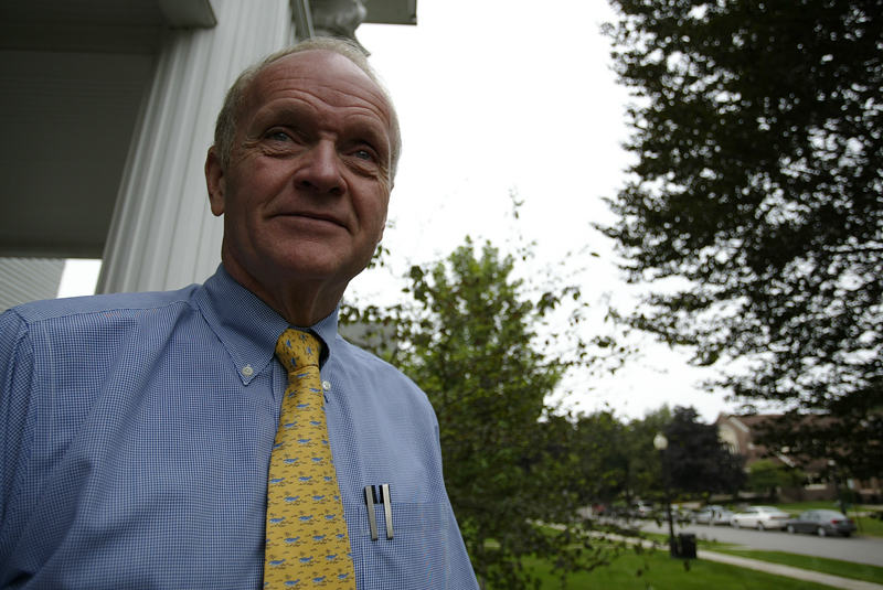 Russel K. Osgood, President of the College poses for a portrait outside Nollen House. - Ben Brewer